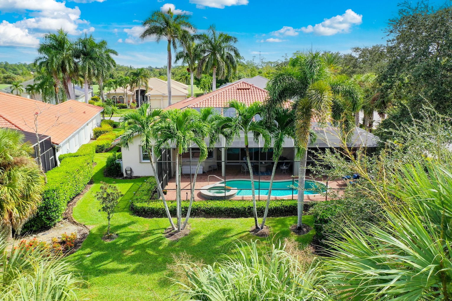 Naples Lakes estate home for sale with a saltwater pool and sp