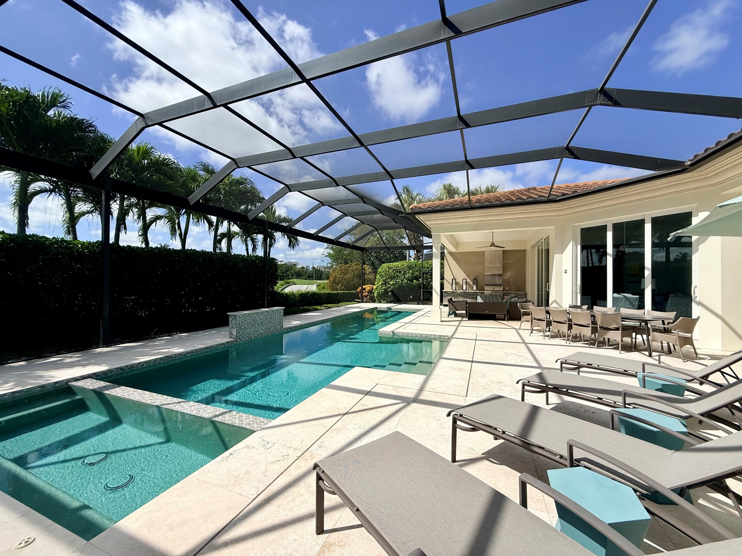 Luxury Grey Oaks Naples home with resort-style pool and outdoor kitchen